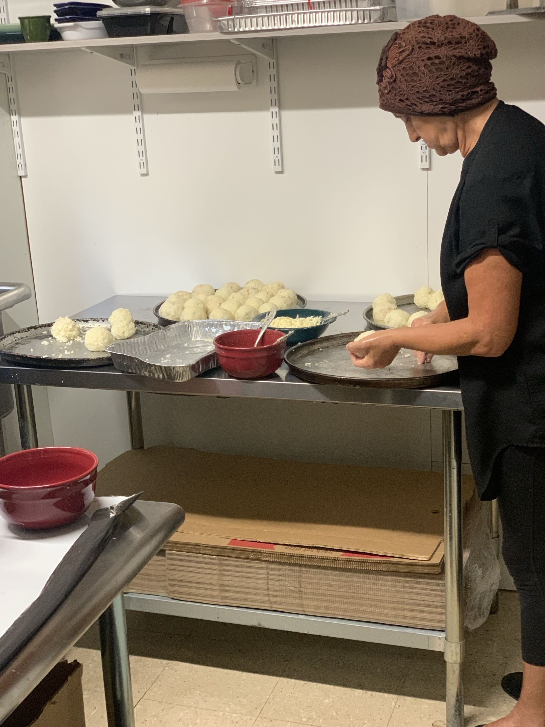 Nonna rolling dough in the Way Station kitchen